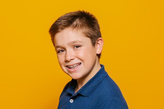 Cheerful young kid looking at camera