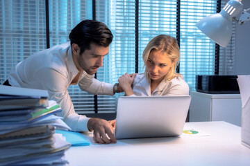 Young Caucasian woman was harassed by a male supervisor at work while she was working overtime at night.