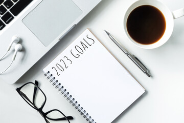Notebook with 2023 goals text on it to apply new year resolutions and plan.