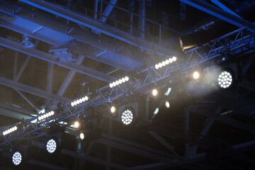 Stage lighting equipment indoor stage. Entertainment concert lighting. Led lighting devices under...