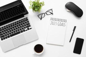 Notebook with 2023 goals text on it to apply new year resolutions and plan.