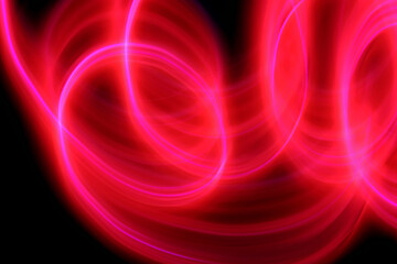 abstract red lines on black background with light painting technique