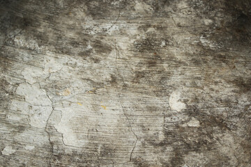 Rough cement wall surface with old cracks, vintage color, abstract pattern for background.