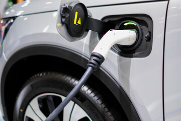 car charging. EV charger car. Cable Pump Plug Electric Vehicle Charging Station EV Car With Modern Technology UI Control Information Display Car Gas Station Information Connect Cable Sustainable Choic