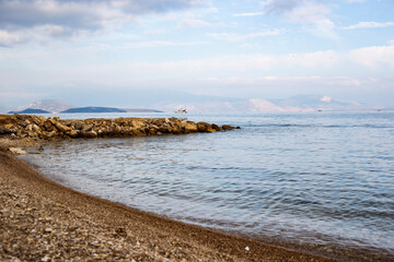 beach and sea ship Aegean cost, blue water and sky 