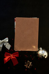 Aesthetic crafting mock up of stationery card, envelope among Christmas decorations. New Year wishing