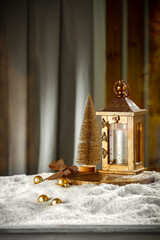 Fototapeta premium Christmas decorations on the table with snow free space in the evening mood