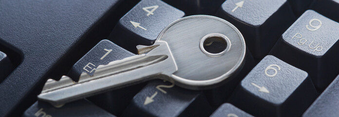 Protecting personal data and money , key on computer keyboard.
