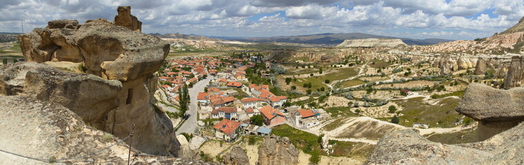 Fototapeta na wymiar View of Cavusin from the rock ridge in Cappadocia,Nevsehir Province,Turkey 