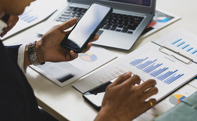 Accountant working financial investment on smart phone, analyze business and marketing growth on financial document data graph, Accounting, Economic, budget planning.