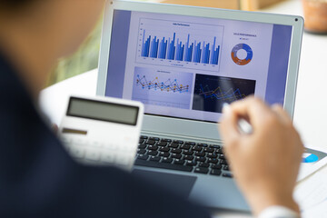 Accountant working financial investment on calculator, calculate, analyze business and marketing growth on financial document data graph, Accounting, Economic, budget planning.