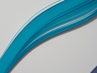 Rainbow colored quilling paper laid out in waves and shapes