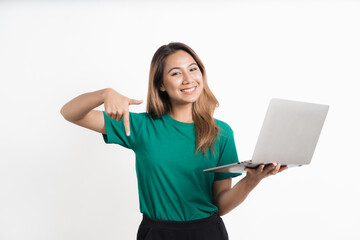Portrait of happy young asian girl using laptop computer isolated over white background.