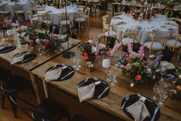 Wooden table with flowers and candles, wedding decoration.