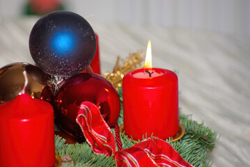 Christmas decoration, Advent wreath with burning candle, concept of Christmas and the Advent season.