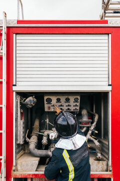 Anonymous fireman reading fire engine data