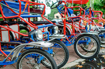 Street bike taxis in the parking lot.