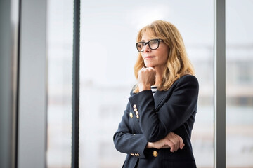 Fototapeta premium Confident caucasian businesswoman against white background