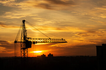 Construction crane at sunset