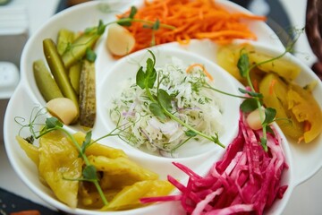 Assorted salted vegetables on a plate.