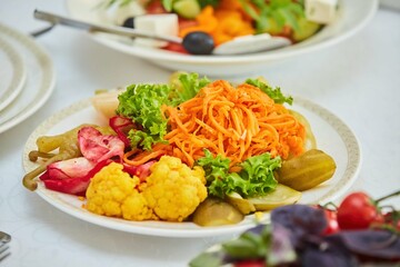 Assorted salted vegetables on a plate.