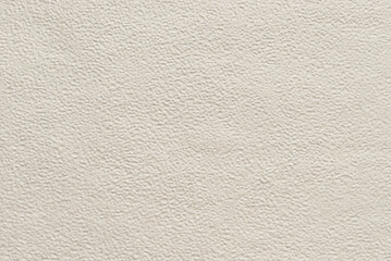 Beige embossed pattern texture as background, beige structured texture or pattern