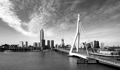 Rotterdam panorama with bridge over river Nieuwe Maas on a sunny blue sky day in South Holland...