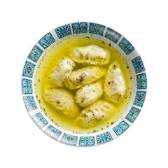 Dumplings in the soup chuchvara Uzbek cuisine isolated on white background top view