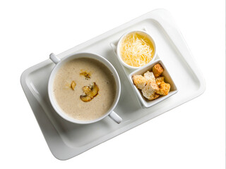 Cream soup of mushrooms isolated on white background top view