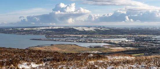 Panoramic view of Belfast harbor from Cave Hill mountain. Newtownards and Bangor area on the snow in winter. Belfast, Northern Ireland.