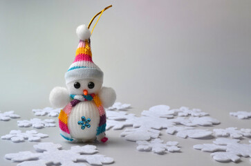 Christmas snowman and snowflakes on a white background.