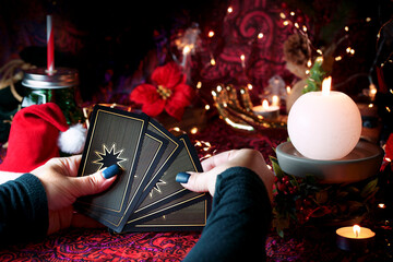  Tarot reader or Fortune teller reading on Christmas decoration.