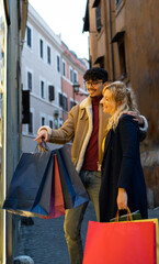 Young multi-ethnic couple doing Christmas shopping