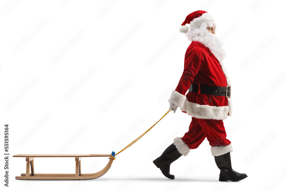 Canvas Prints full length profile shot of santa claus pulling a wooden sleigh