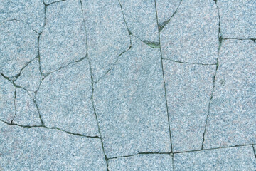 Stone texture. Deep cracks on marble slab close-up.