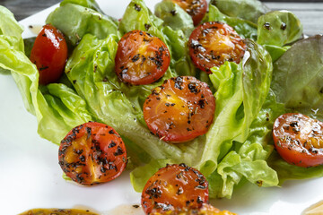 Cherry tomatoes and lettuce in white wine sauce