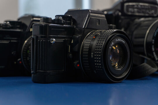 Some iconic old black cameras - Powered by Adobe