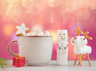Christmas mug with hot chocolate, marshmallows and red gift box. handmade marshmallow snowman and...
