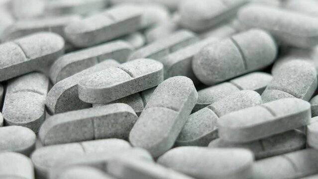Sedative pills with tryptophan close-up. Remedy for depression and insomnia. Natural pharmaceutical antidepressant