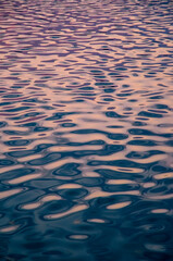 Beautiful abstract watercolor natural background of rippled water surface with distorted clouds and clear blue sky reflections. Copy space for​ graphic​ design