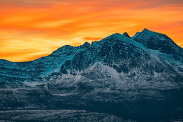 sunset in snowy mountains