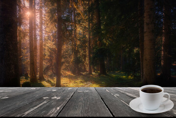Coffee cup on wood table and view of beautiful nature background