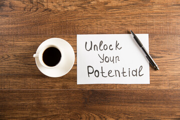 The inscription Unlock your potential and coffee