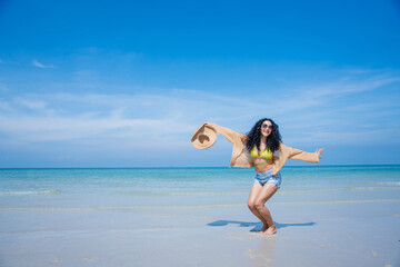 Fototapeta na wymiar Happy girls enjoying freedom with open hands on the beach., Summer holidays and vacation concept..