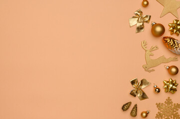 Christmas, New Year composition. Flat lay of golden christmas decorations on beige background. Winter holidays concept