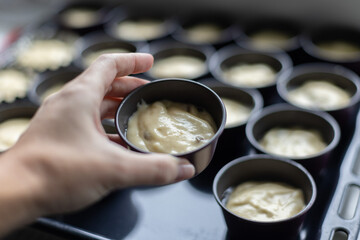 Womans hand holding cookie cutter with dough. Baking items. Selective focus.