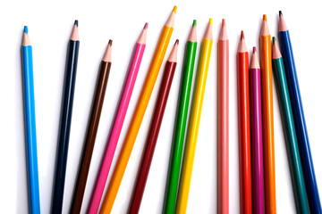 Colored pencils isolated on a white background, a place for advertising.