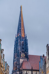 Munster, NRW, Germany. View of St Lambert's Church at dusk. 'Himmel Leiter in Munster' - obrazy, fototapety, plakaty