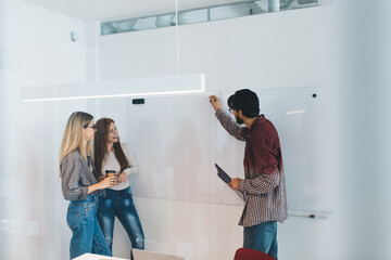 Obraz premium Team of coworkers with papers brainstorming
