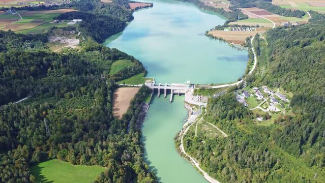 Aerial drone view of the water power plant Endling at the river Drau	

